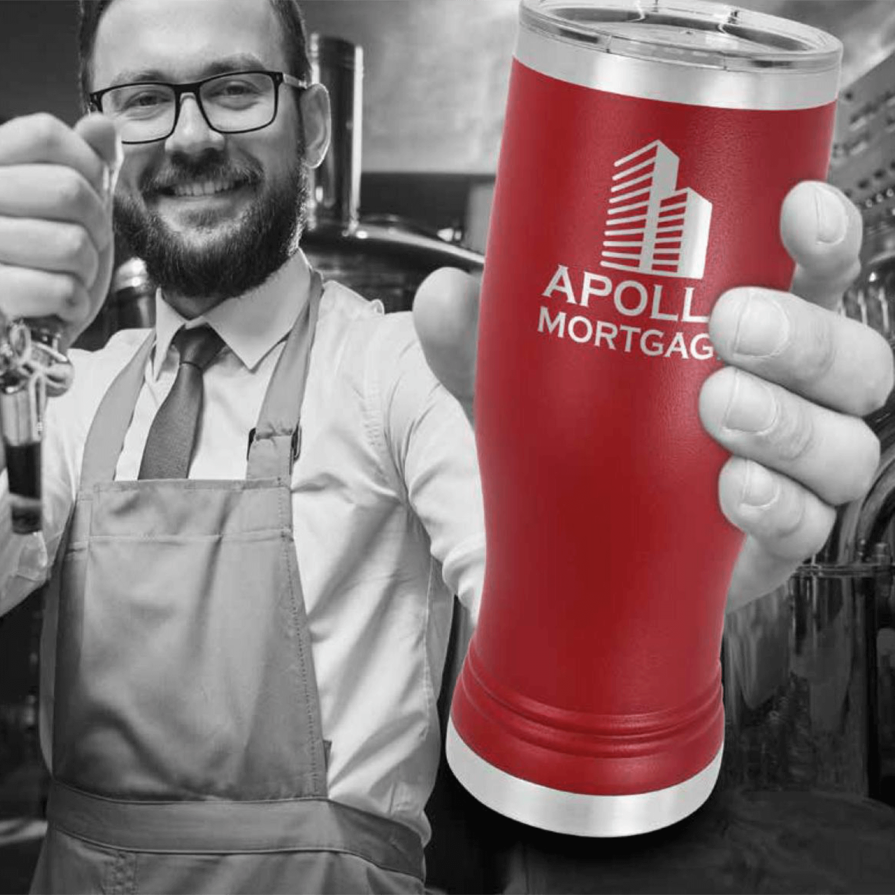A Man in an Apron in Black and White Holding a Red Cup