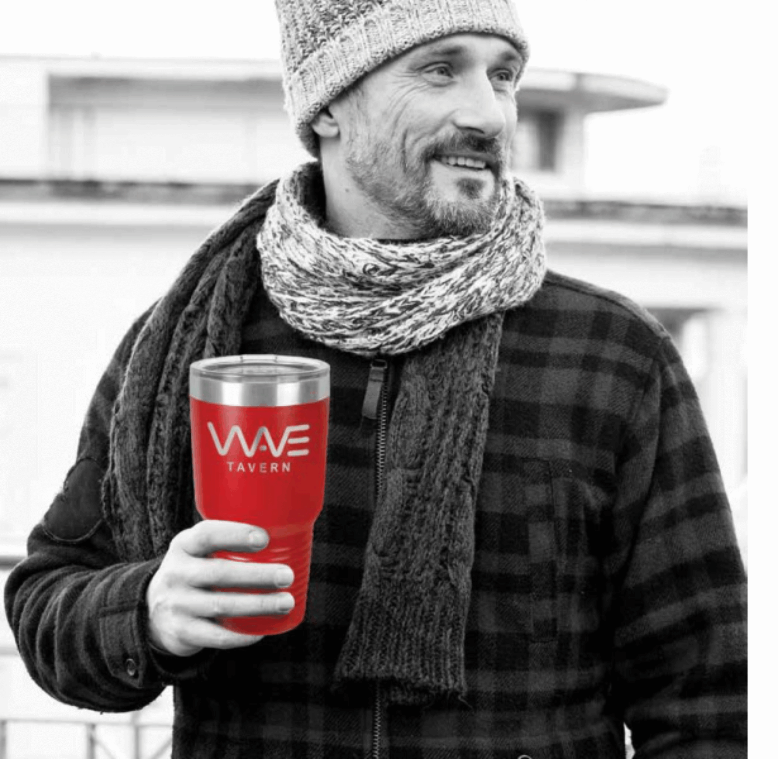 A Man in a Scarf In Black and White Holding a Red Cup