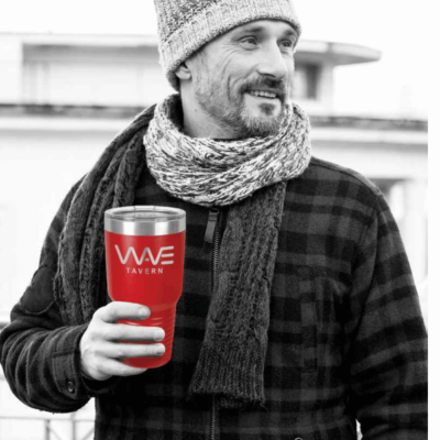A Man in a Scarf In Black and White Holding a Red Cup